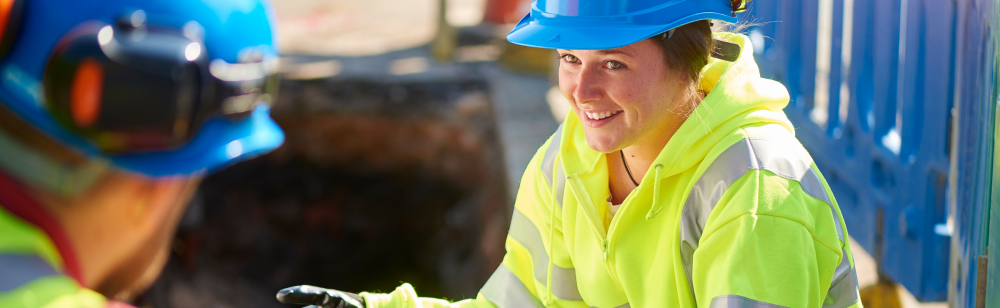 Female construction worker wearing reflective gear